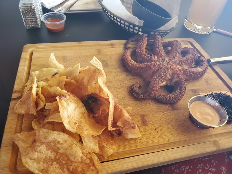 Printed menu with seafood, steak, and drinks.