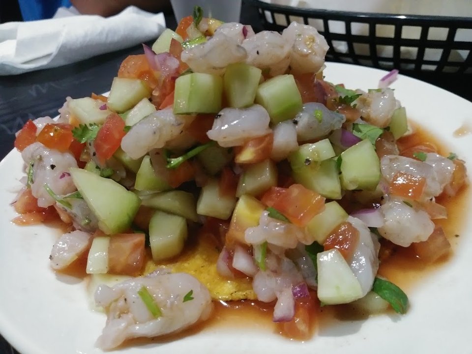 Drink and food menu for mariscos and steaks.