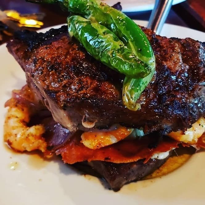 Drink and food menu for mariscos and steaks.